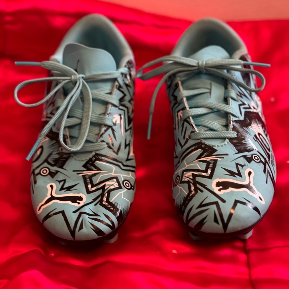 Puma kids soccer cleats.